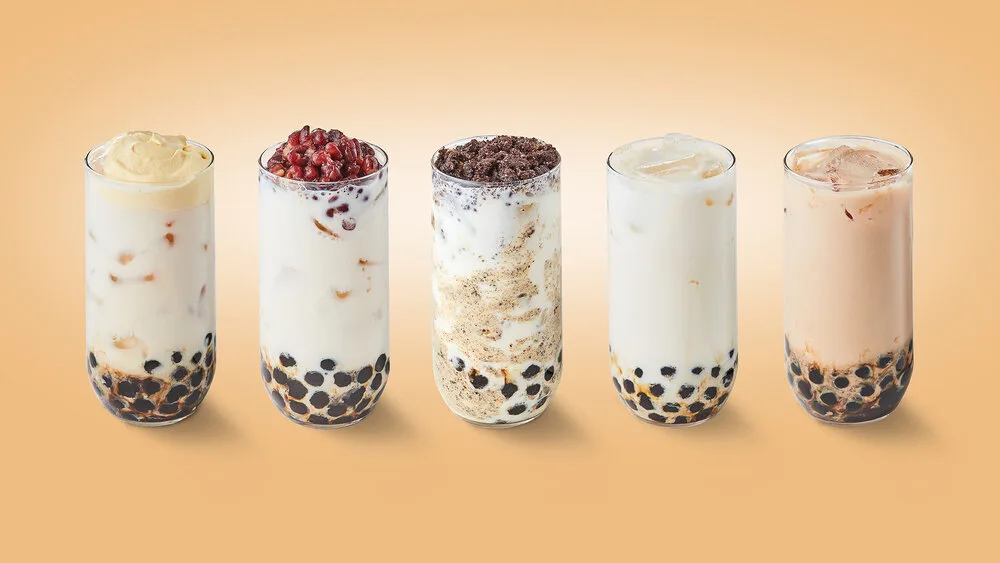 creme brulee boba milk, red bean on boba milk, oreo brulee boba milk, original boba milk, and sunright boba milk in a row